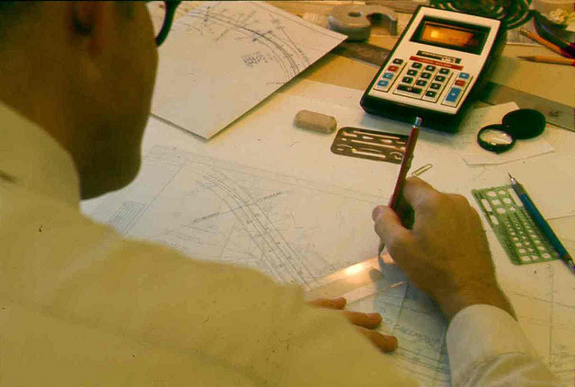 Draftsman at work on map of Lakemont Blvd(?), circa 1970